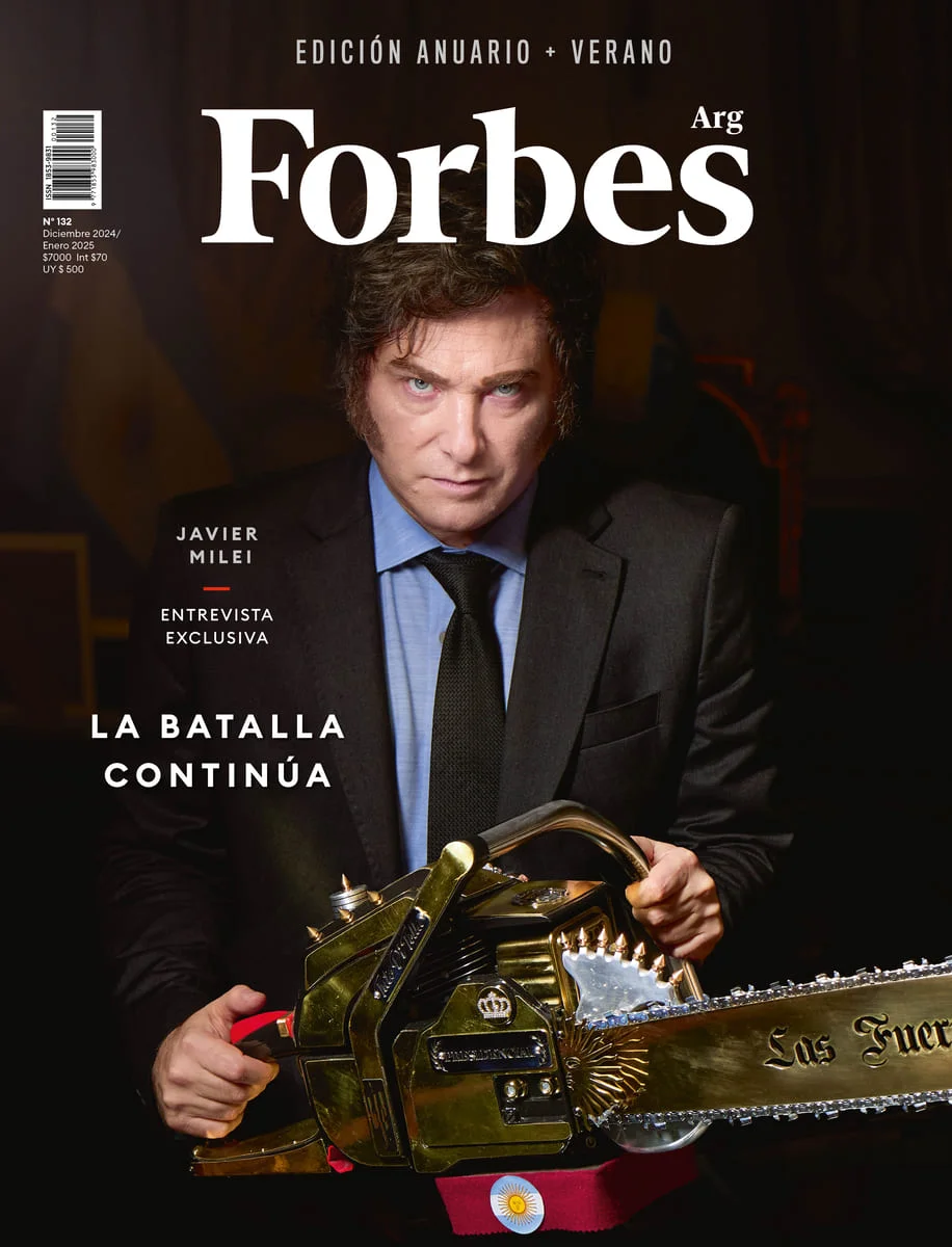 1javier milei holding the chainsaw on the cover of forbes magazine 1