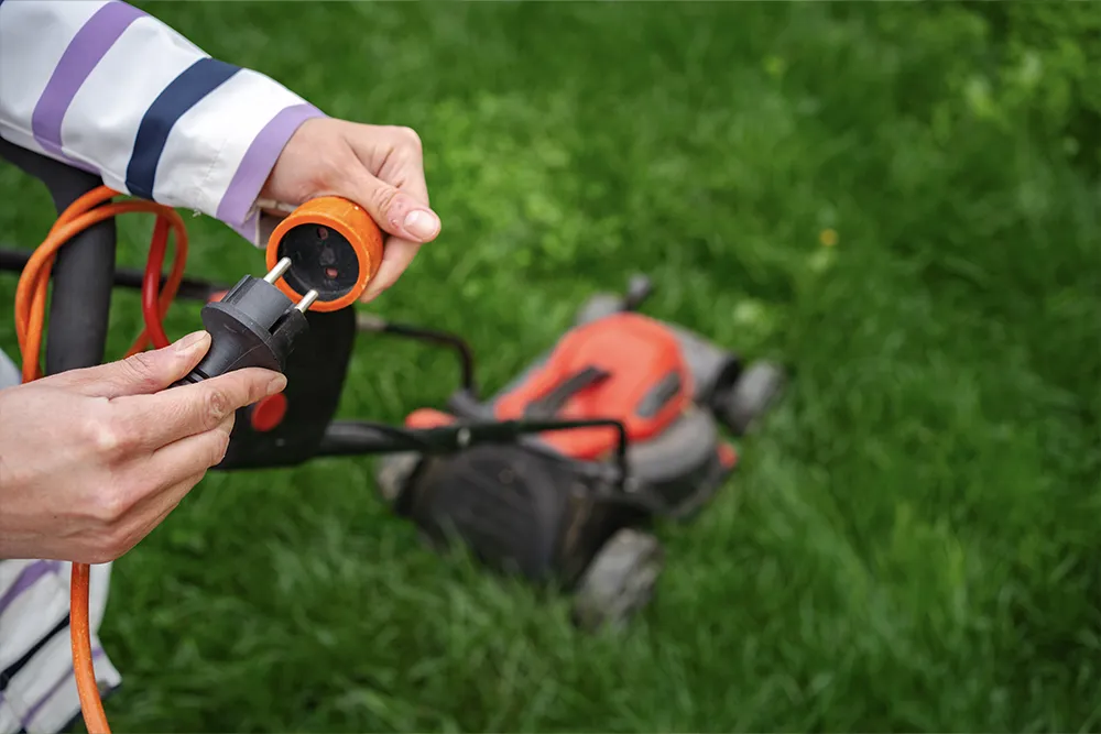 3.the person is replacing the mowing line on the lawnmower.