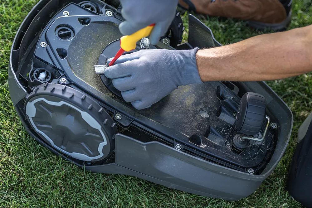 5.changing the oil or blades of a lawnmower.